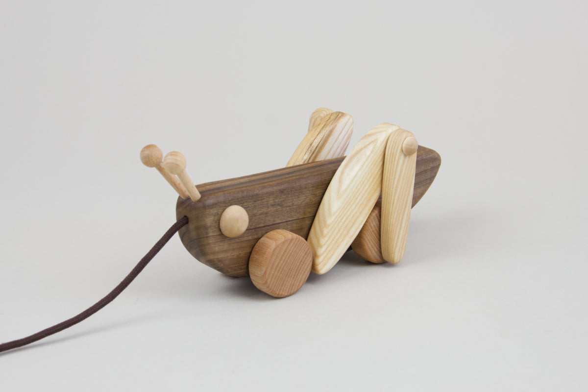 Wooden grasshopper best sale pull toy